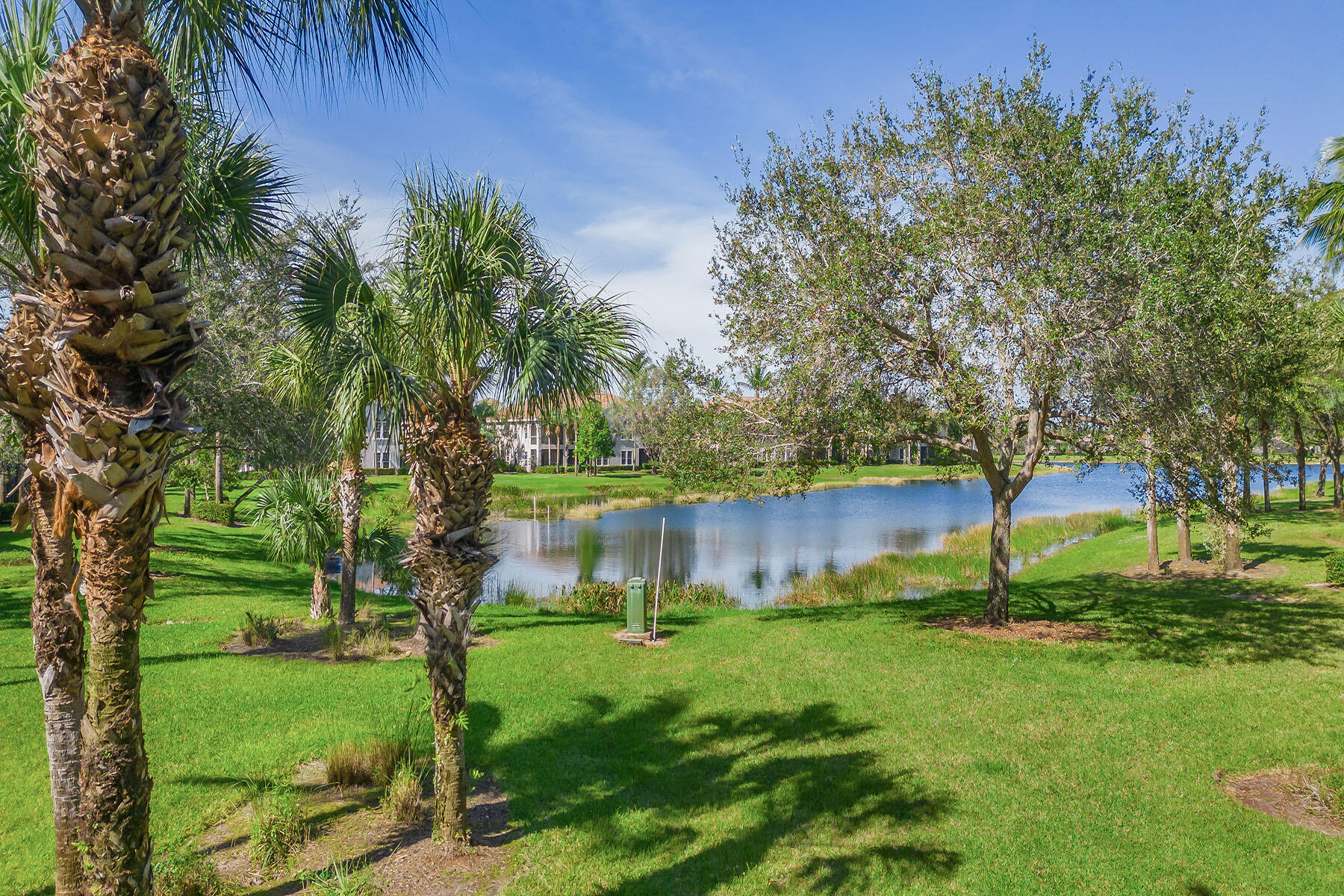 3189 Aviamar Circle, Unit 202 Naples, FL 34114 - Photo 26 of 50 a backyard of a house with lots of green space