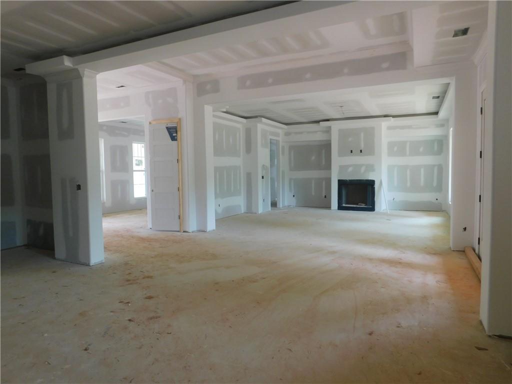 1534 Red Cedar Road Commerce, GA 30530 - Photo 8 of 11 a view of empty room with a fireplace