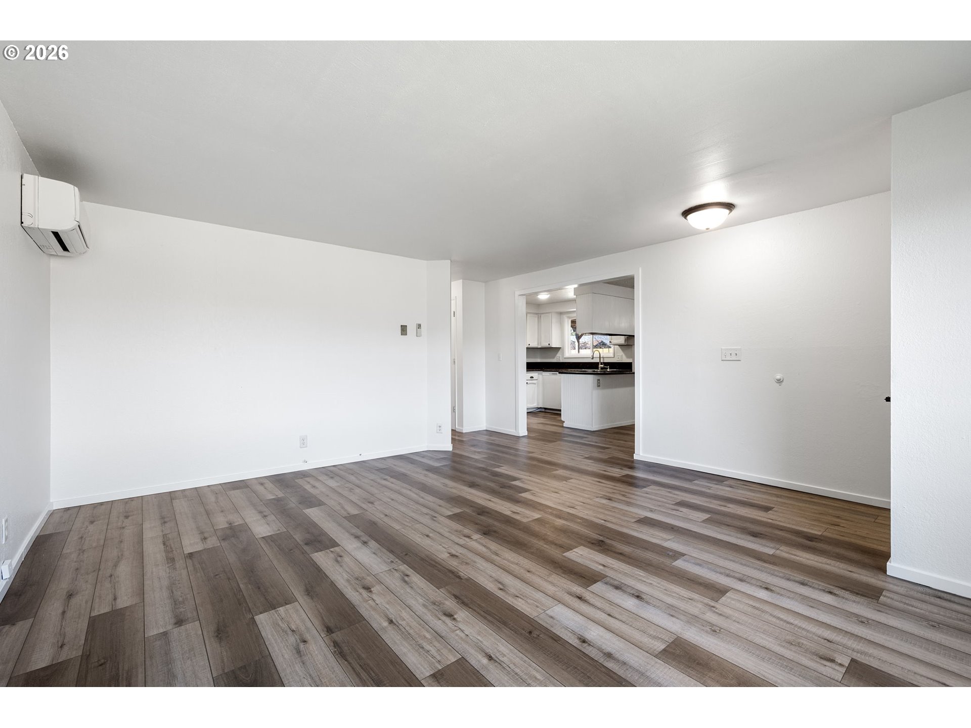 422 South 49th Place Springfield, OR 97478 - Photo 5 of 32 a view of empty room with wooden floor