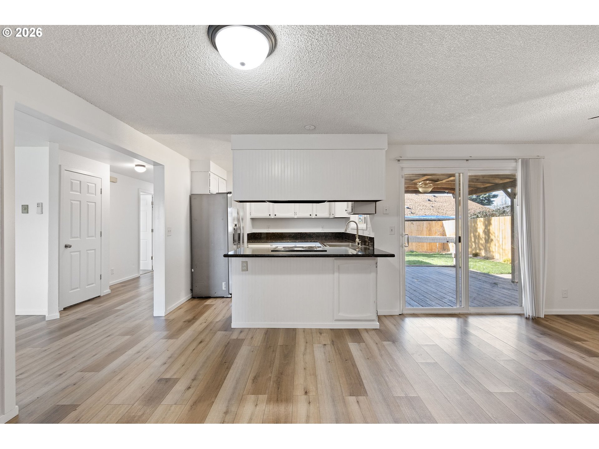 422 South 49th Place Springfield, OR 97478 - Photo 10 of 32 a view of kitchen with sink and wooden floor