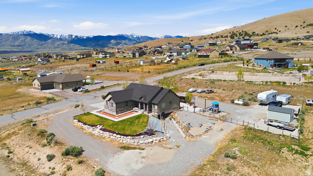 1588 West Rim Rock Drive Stockton, UT 84071 - Photo 2 of 61 Ranch-style residence featuring a stone facade and dark shingle roof
