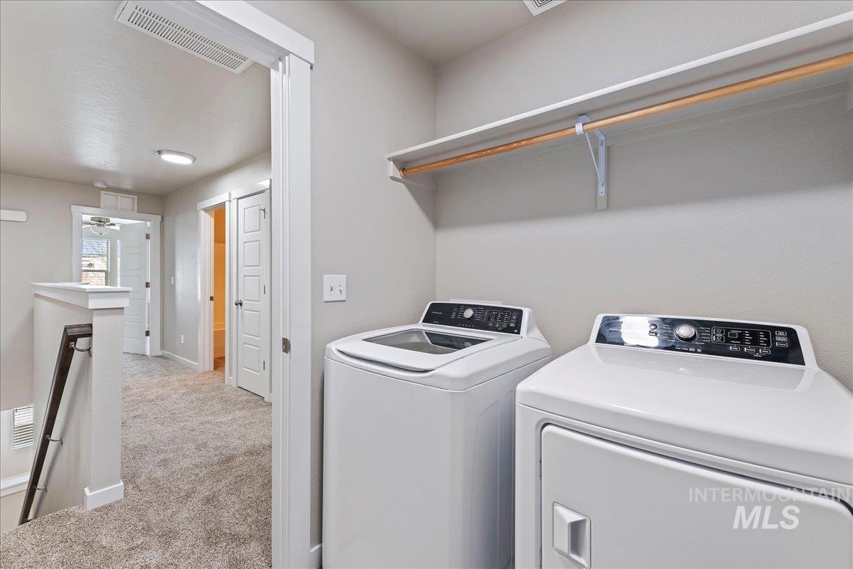 2517 East Goldstone Street Meridian, ID 83642 - Photo 18 of 22 Laundry area featuring light colored carpet and separate washer and dryer