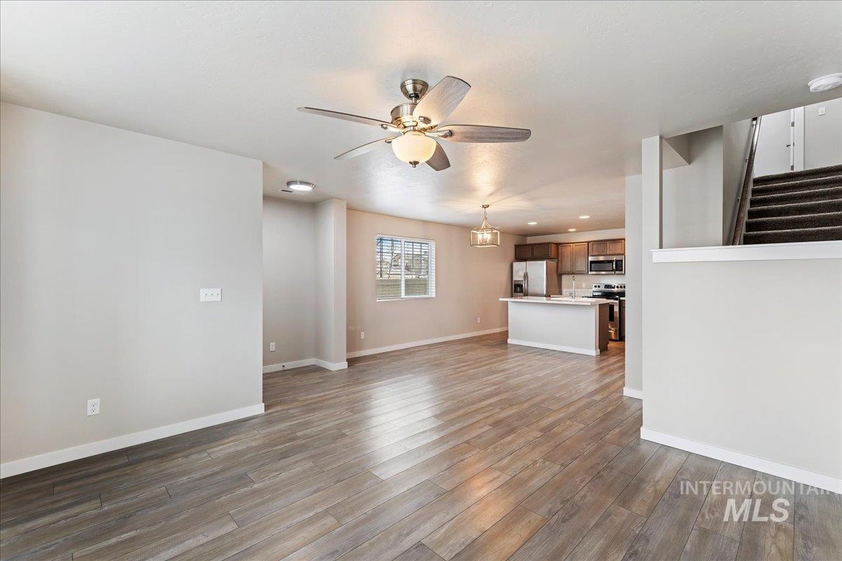 2517 East Goldstone Street Meridian, ID 83642 - Photo 6 of 22 Unfurnished living room with ceiling fan, dark wood-style floors, and recessed lighting
