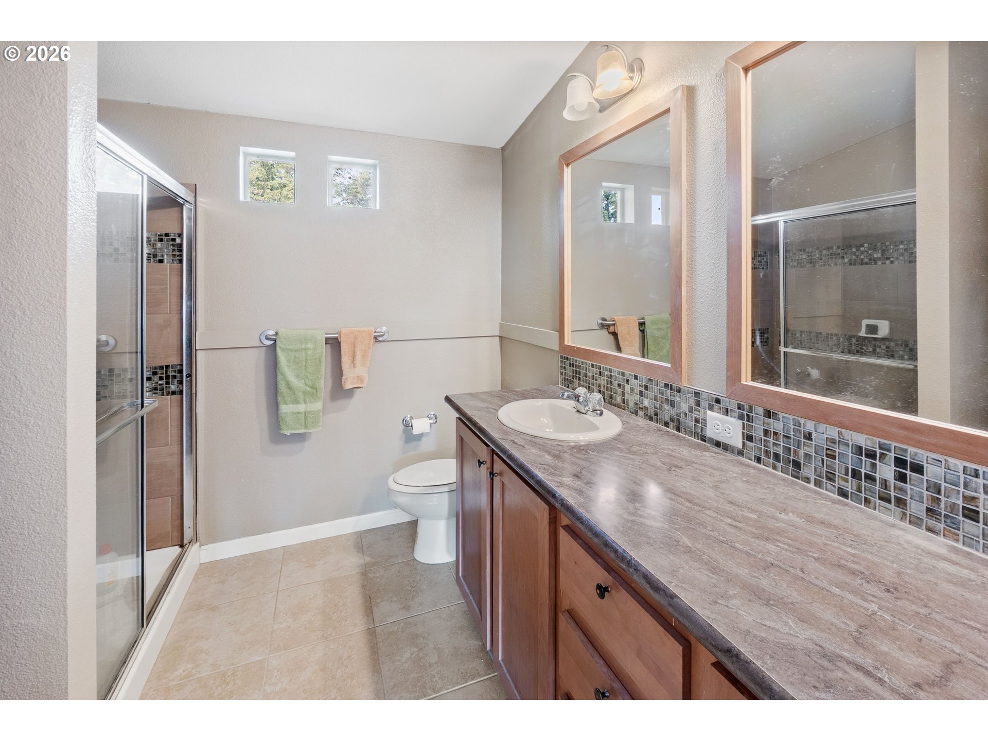 95300 Grassy Knob Road Port Orford, OR 97465 - Photo 12 of 25 a bathroom with a granite countertop sink a toilet a mirror and shower