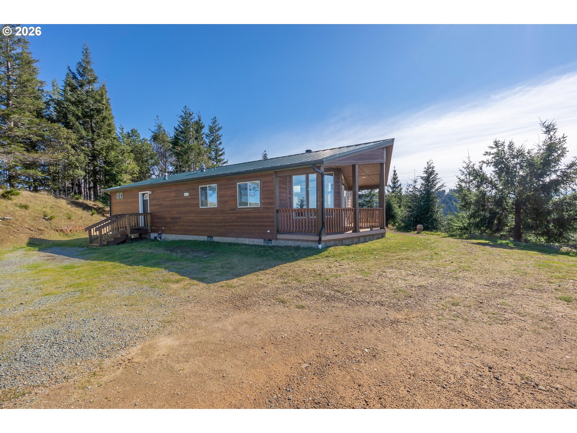 95300 Grassy Knob Road Port Orford, OR 97465 - Photo 2 of 25 a view of a house with backyard and a garden