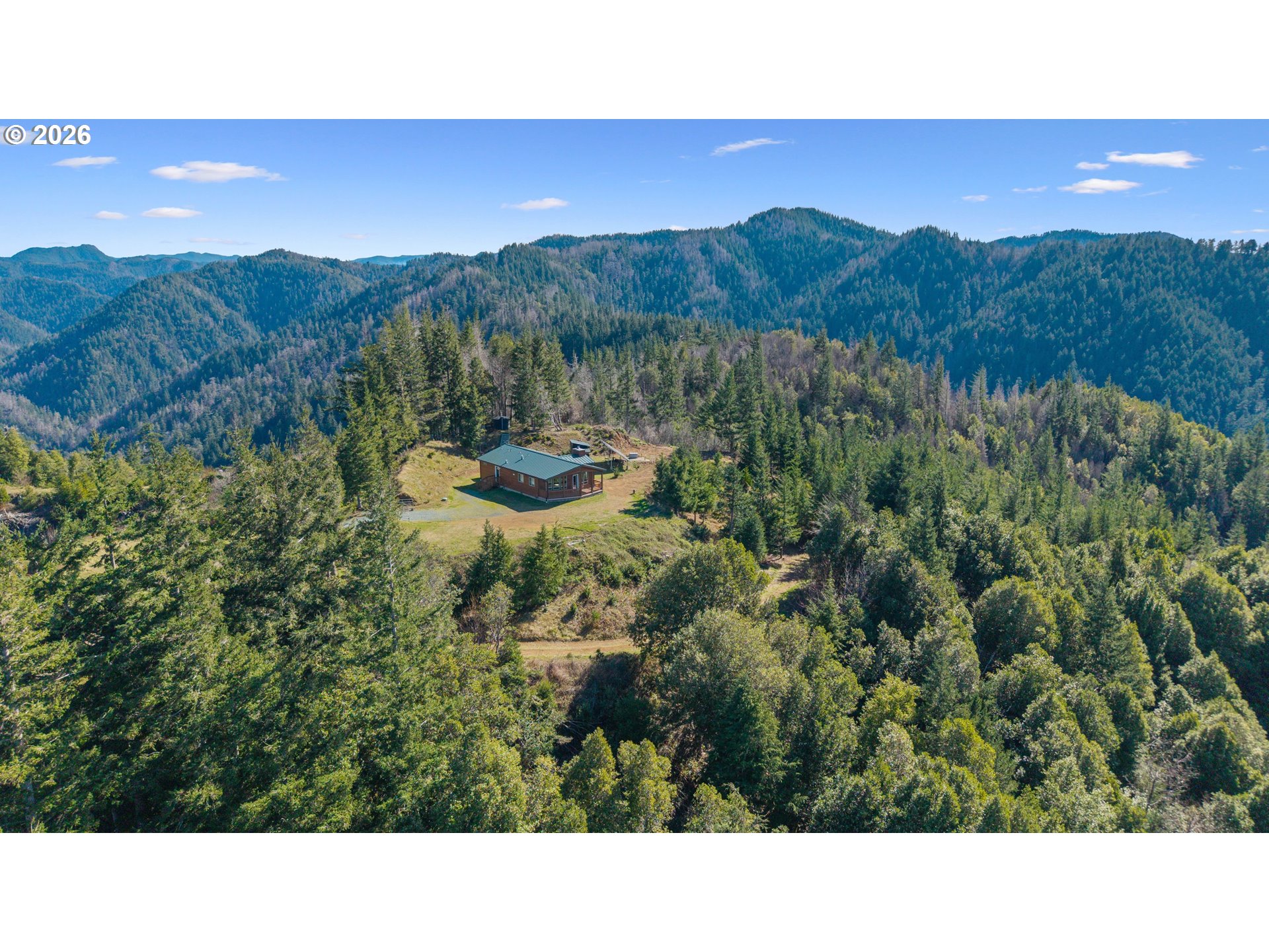 95300 Grassy Knob Road Port Orford, OR 97465 - Photo 22 of 25 a open area with mountains in the background