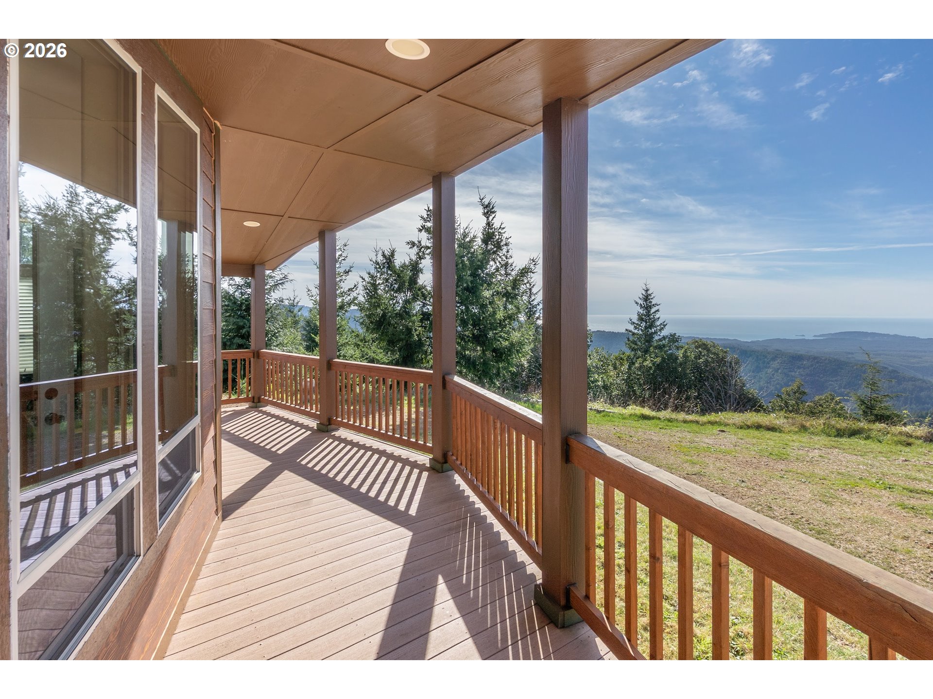 95300 Grassy Knob Road Port Orford, OR 97465 - Photo 4 of 25 a view of a balcony with wooden floor next to a yard