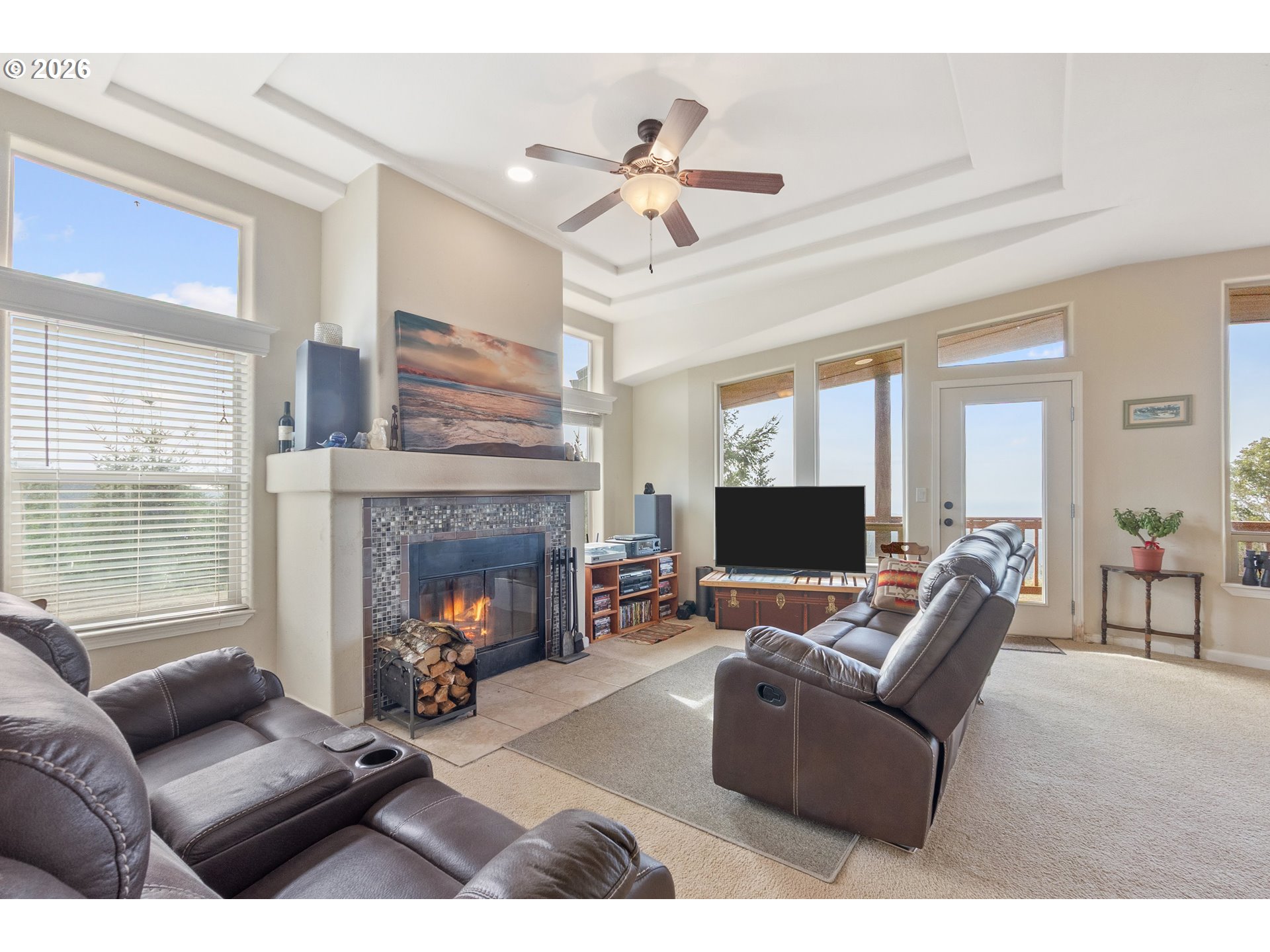 95300 Grassy Knob Road Port Orford, OR 97465 - Photo 5 of 25 a living room with furniture a fireplace and a flat screen tv
