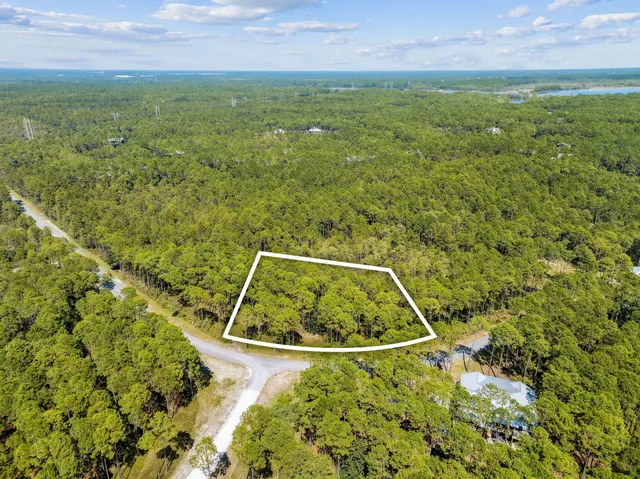 a view of a field with an outdoor space