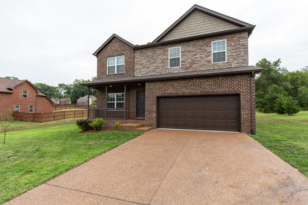 257 Abbey Road Lebanon, TN 37090 - Photo 1 of 18 a front view of a house with yard and green space