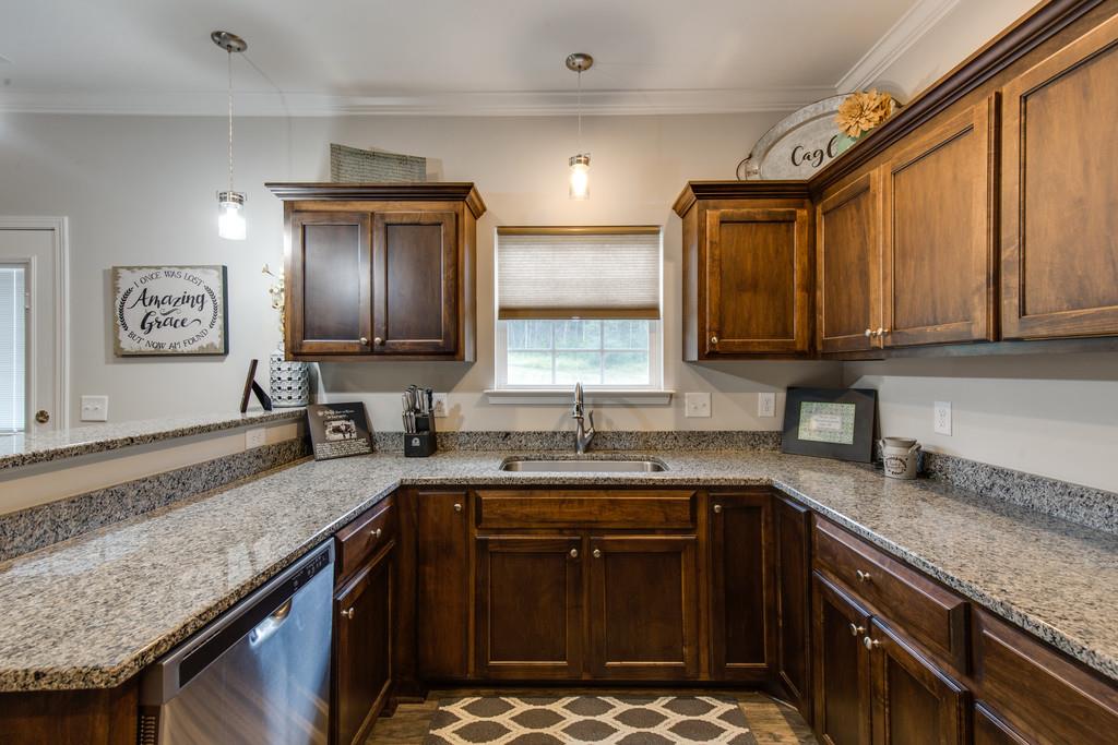 257 Abbey Road Lebanon, TN 37090 - Photo 8 of 18 a kitchen with a sink stove and cabinets