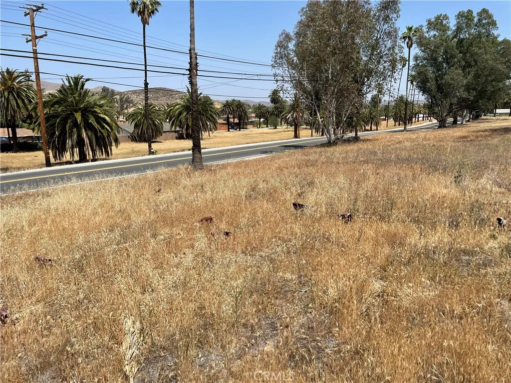 16 Riverside Drive Lake Elsinore, CA 92530 - Photo 30 of 34 a view of a street with a building in the background