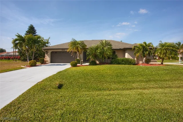 a front view of house with yard and green space