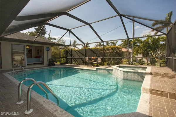a view of a swimming pool with a patio