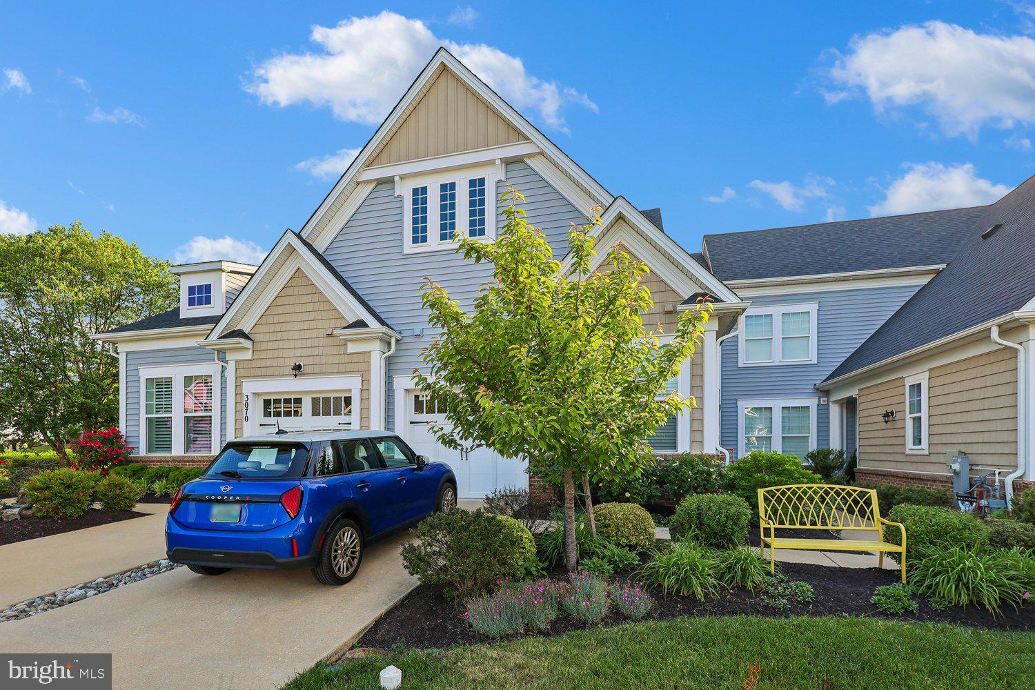 3068 Spring Peeper Court Odenton, MD 21113 - Photo 2 of 29 a front view of a house with a garden