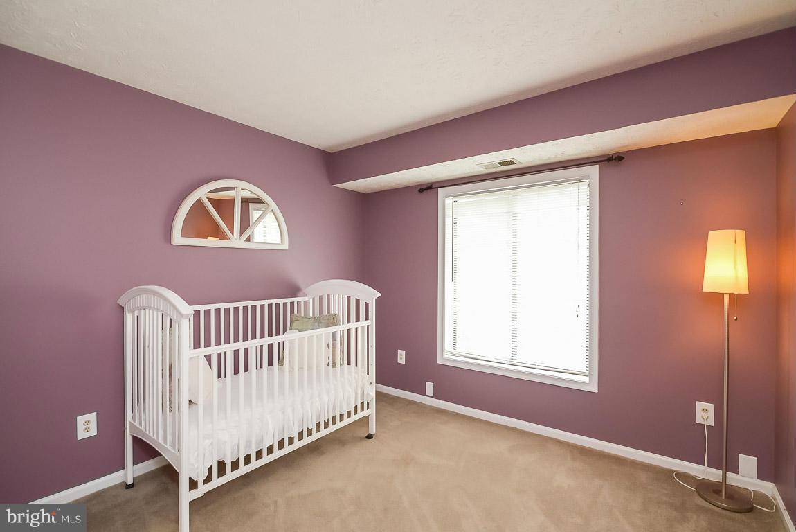 2253 Hunter's Run Drive, Unit 2253 Reston, VA 20191 - Photo 20 of 25 a view of an empty room with a window