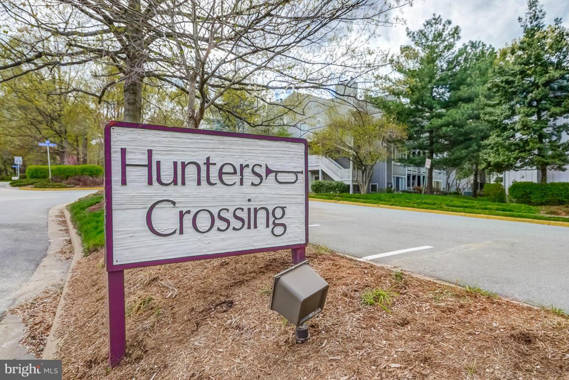 2253 Hunter's Run Drive, Unit 2253 Reston, VA 20191 - Photo 23 of 25 a sign broad on the side of the road