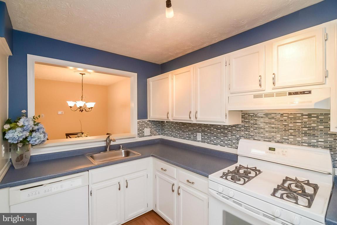 2253 Hunter's Run Drive, Unit 2253 Reston, VA 20191 - Photo 9 of 25 a kitchen with a sink and large window