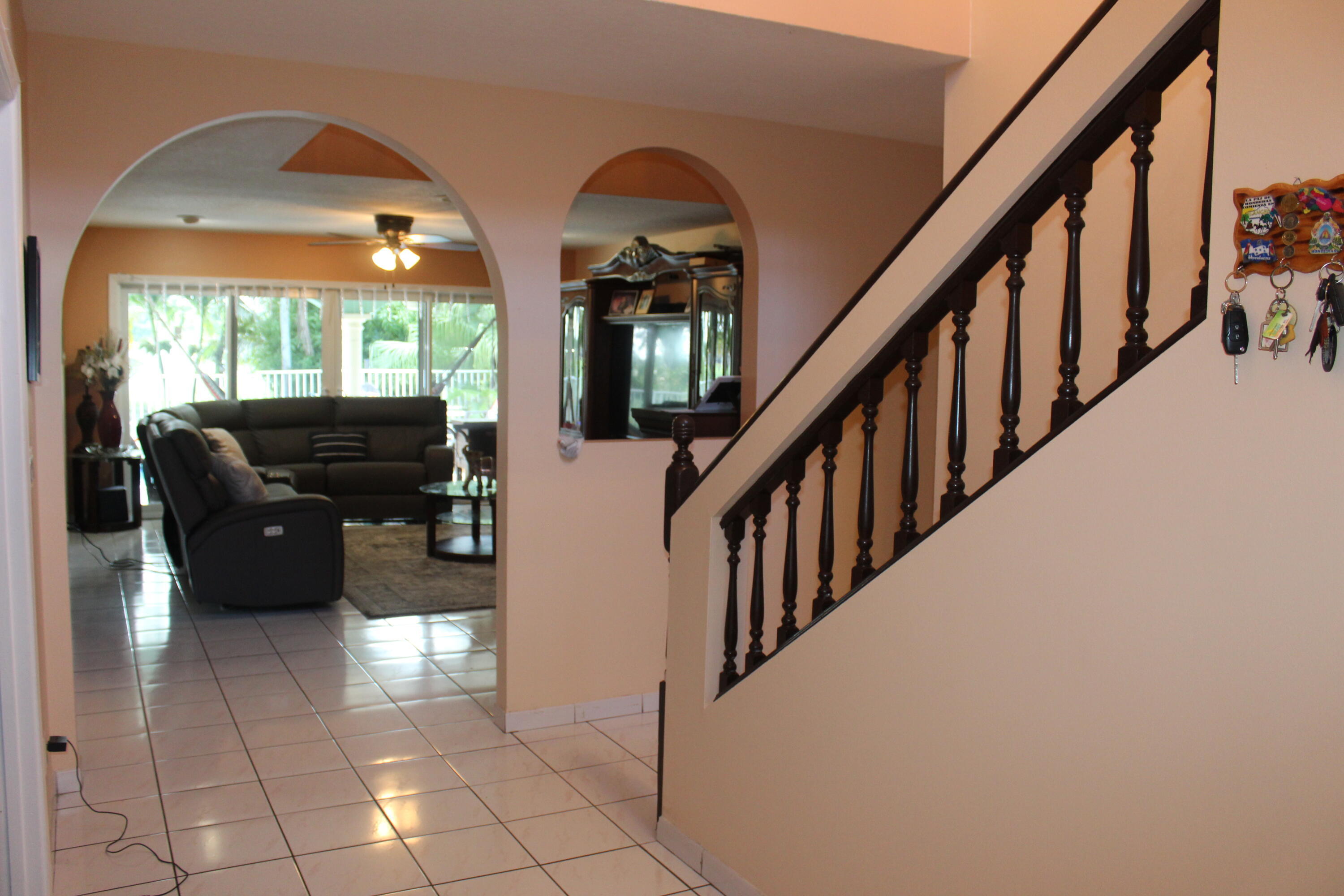 13847 Geranium Place Wellington, FL 33414 - Photo 15 of 50 a view of hall way with furniture and staircase