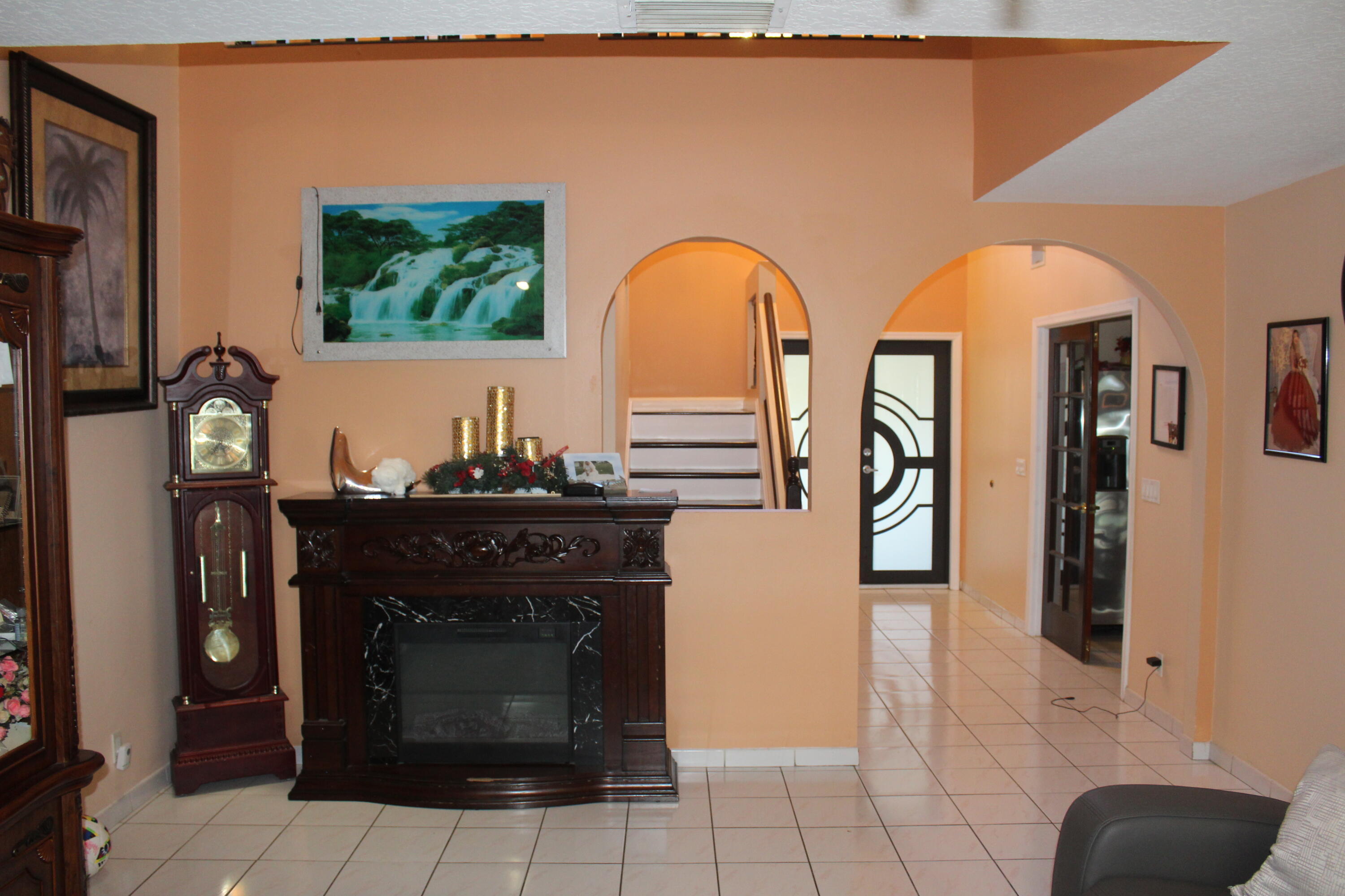 13847 Geranium Place Wellington, FL 33414 - Photo 16 of 50 a view of living room with furniture and a fireplace