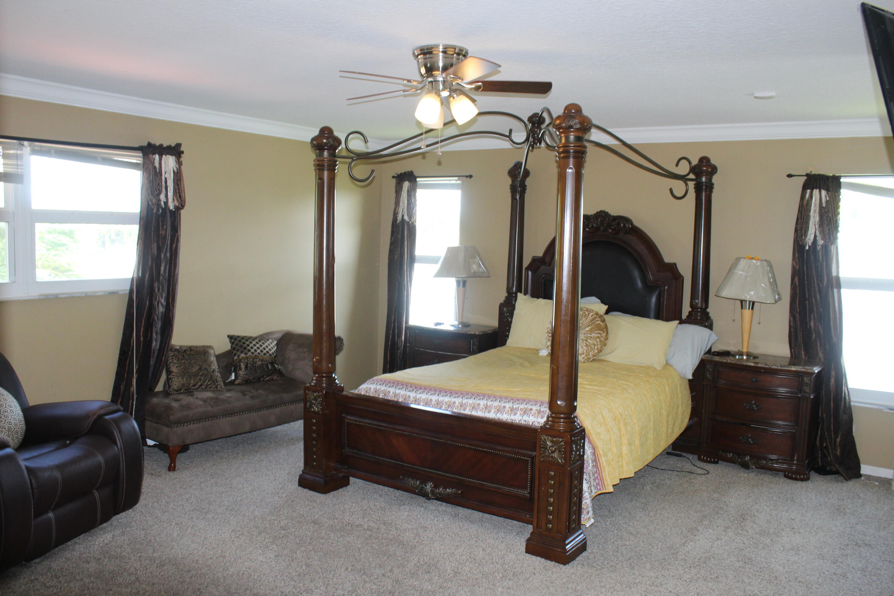 13847 Geranium Place Wellington, FL 33414 - Photo 32 of 50 a bedroom with a bed a couch and dresser