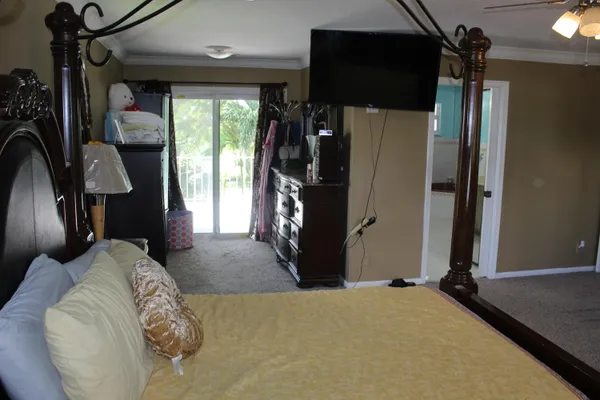 a bed room with a bed and a mirror