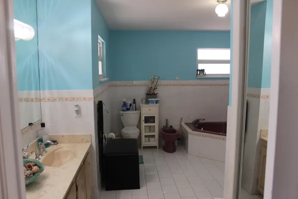 a bathroom with a bathtub sink and toilet