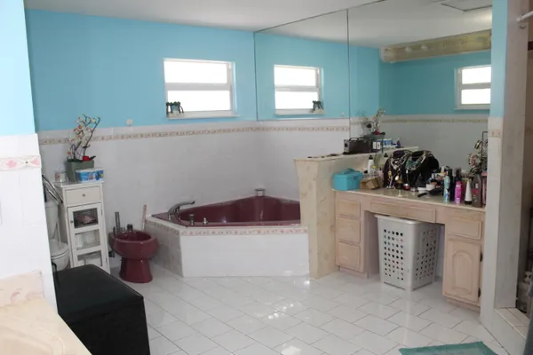 a kitchen with a cabinets and window