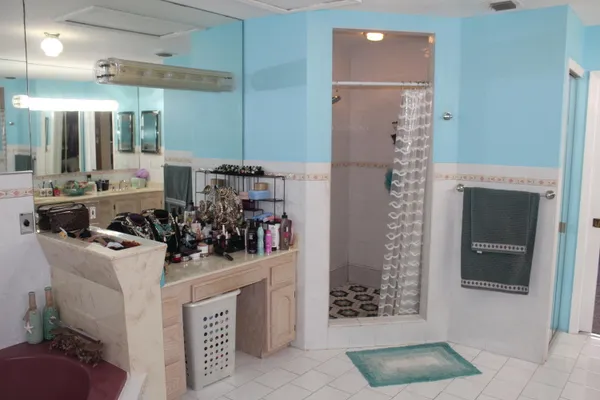 a bathroom with a double vanity sink a and mirror