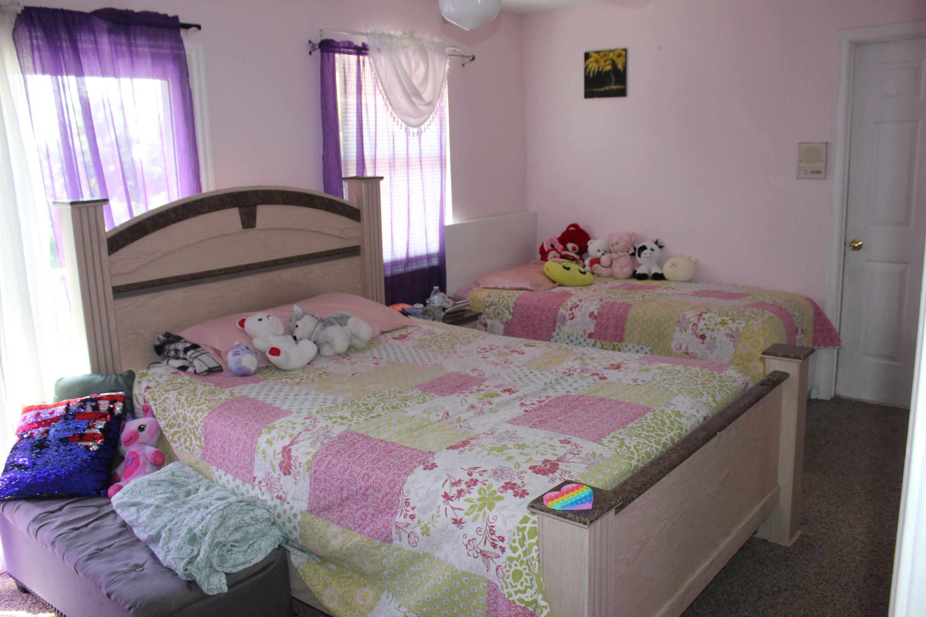 13847 Geranium Place Wellington, FL 33414 - Photo 39 of 50 a bedroom with a bed and a window