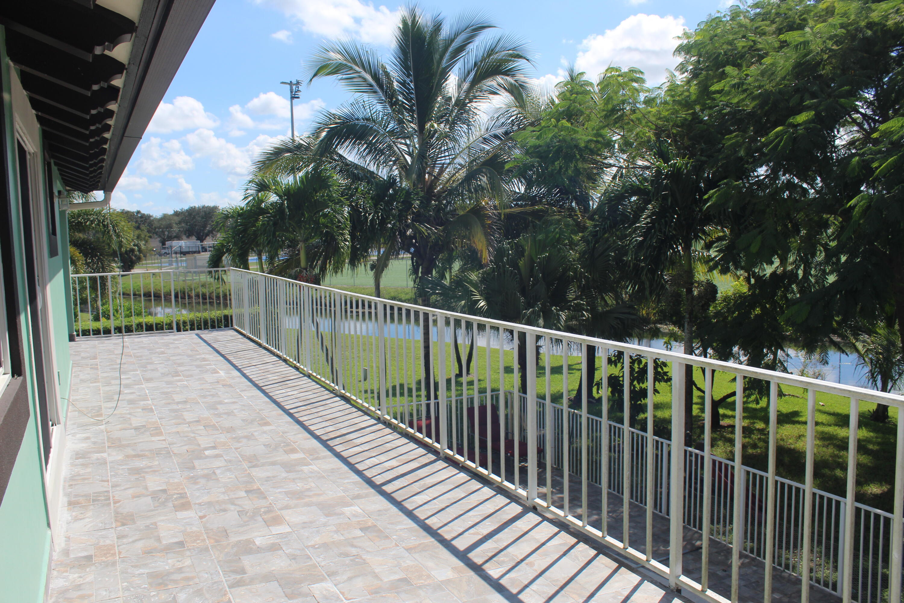 13847 Geranium Place Wellington, FL 33414 - Photo 42 of 50 a view of balcony and yard