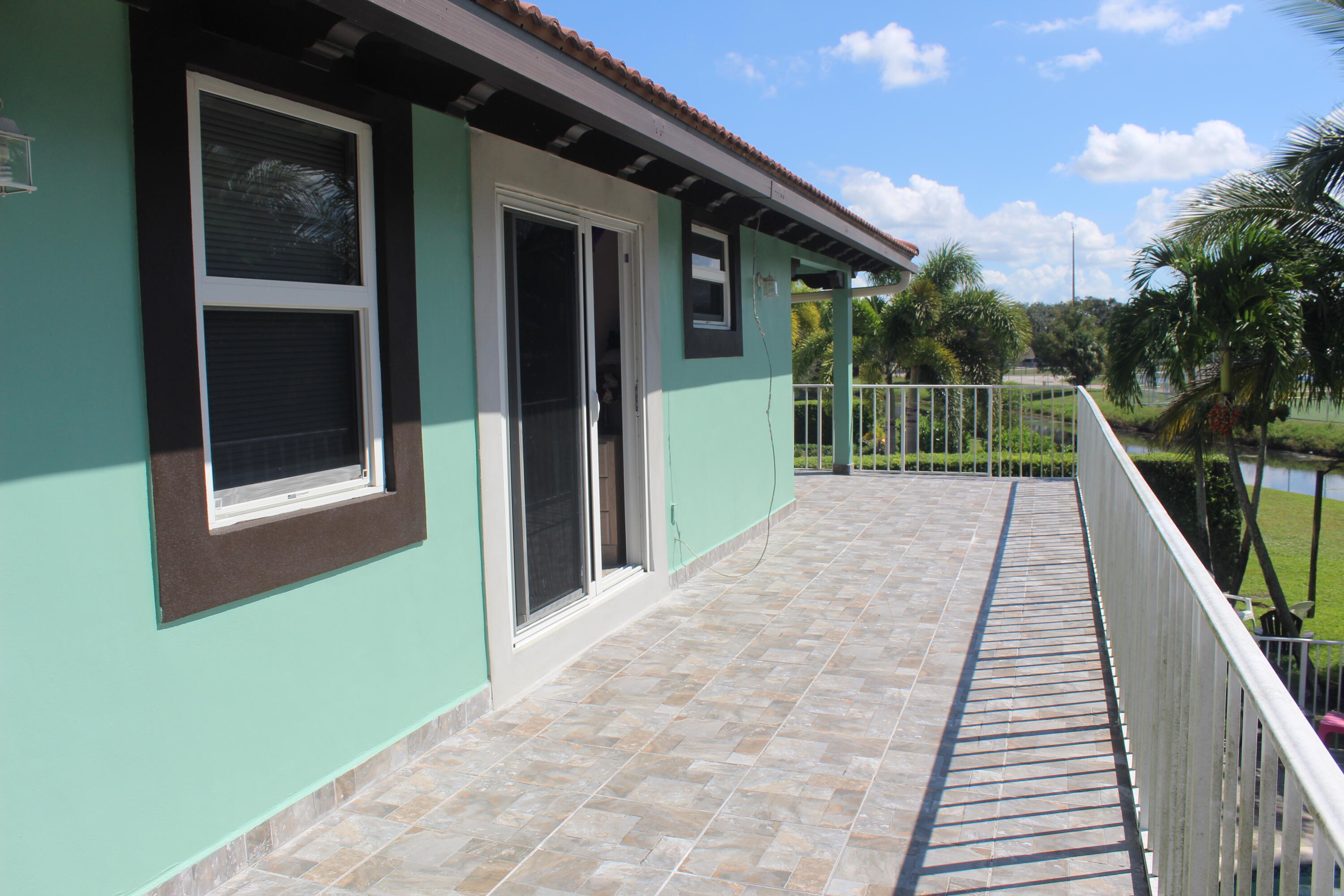 13847 Geranium Place Wellington, FL 33414 - Photo 43 of 50 a view of balcony and deck