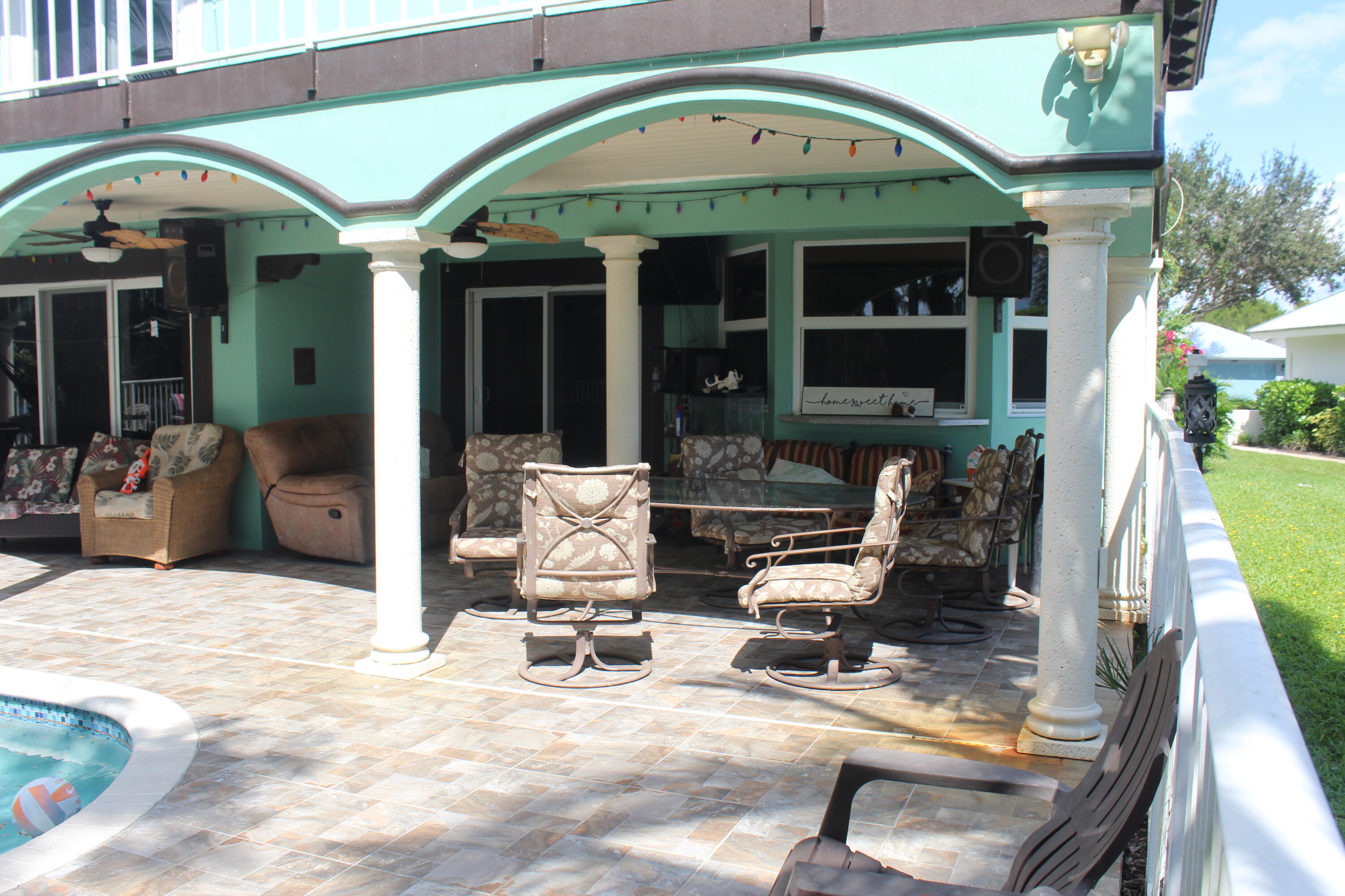13847 Geranium Place Wellington, FL 33414 - Photo 10 of 50 a view of a patio with a table and chairs