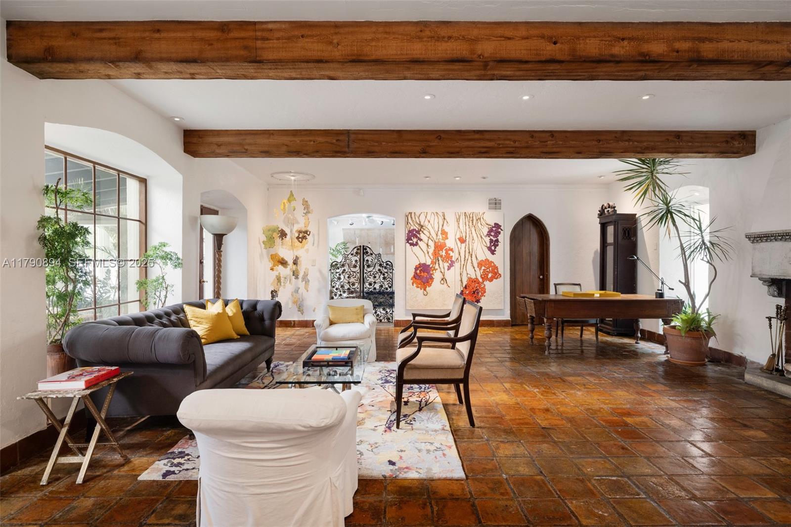 5215 Pine Tree Drive Miami Beach, FL 33140 - Photo 12 of 28 a living room with furniture and wooden floor