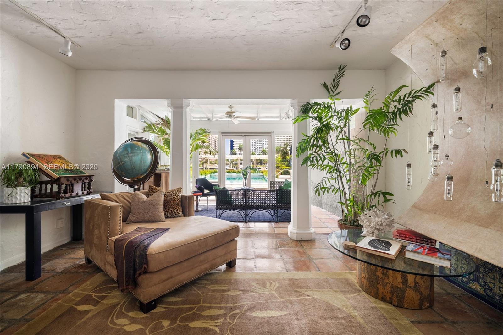 5215 Pine Tree Drive Miami Beach, FL 33140 - Photo 14 of 28 a living room with furniture and a fireplace