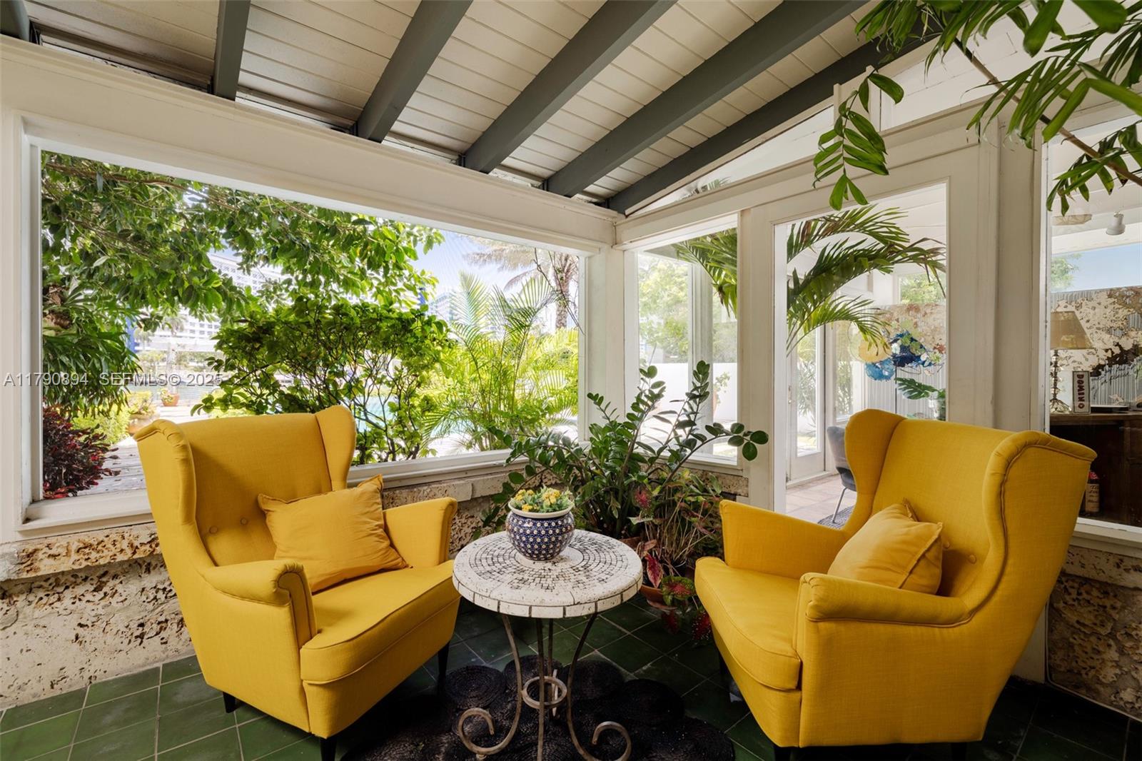 5215 Pine Tree Drive Miami Beach, FL 33140 - Photo 15 of 28 a outdoor living space with furniture and a potted plant