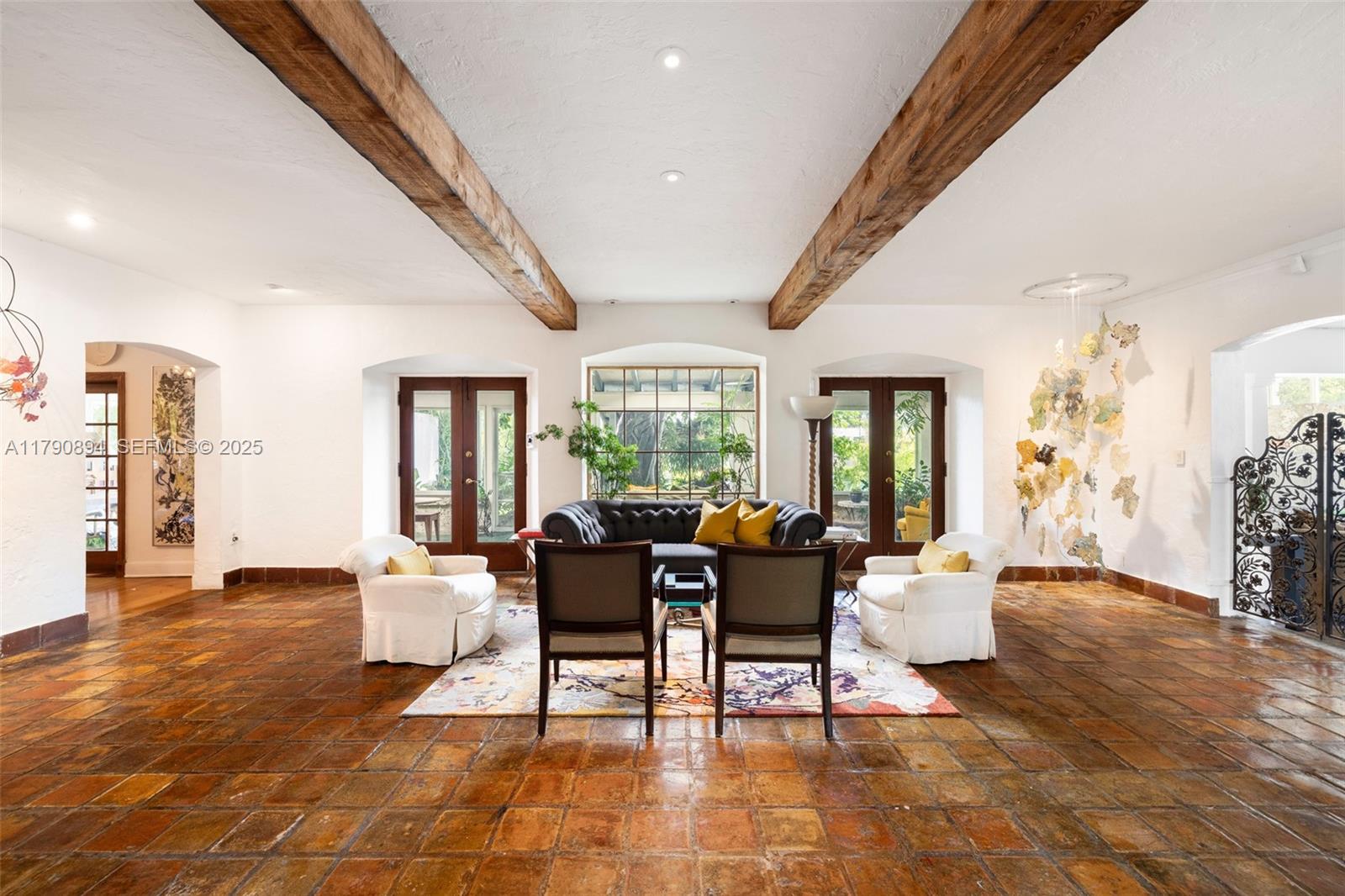 5215 Pine Tree Drive Miami Beach, FL 33140 - Photo 6 of 28 a living room with furniture and wooden floor
