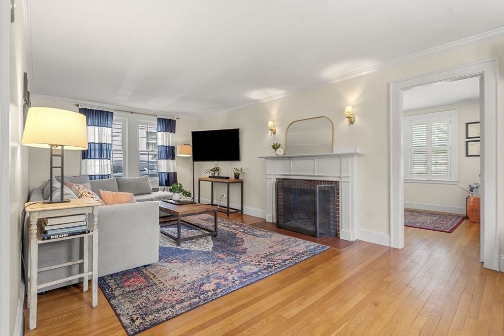 56 Allen Circle Milton, MA 02186 - Photo 15 of 34 a living room with furniture and a fireplace