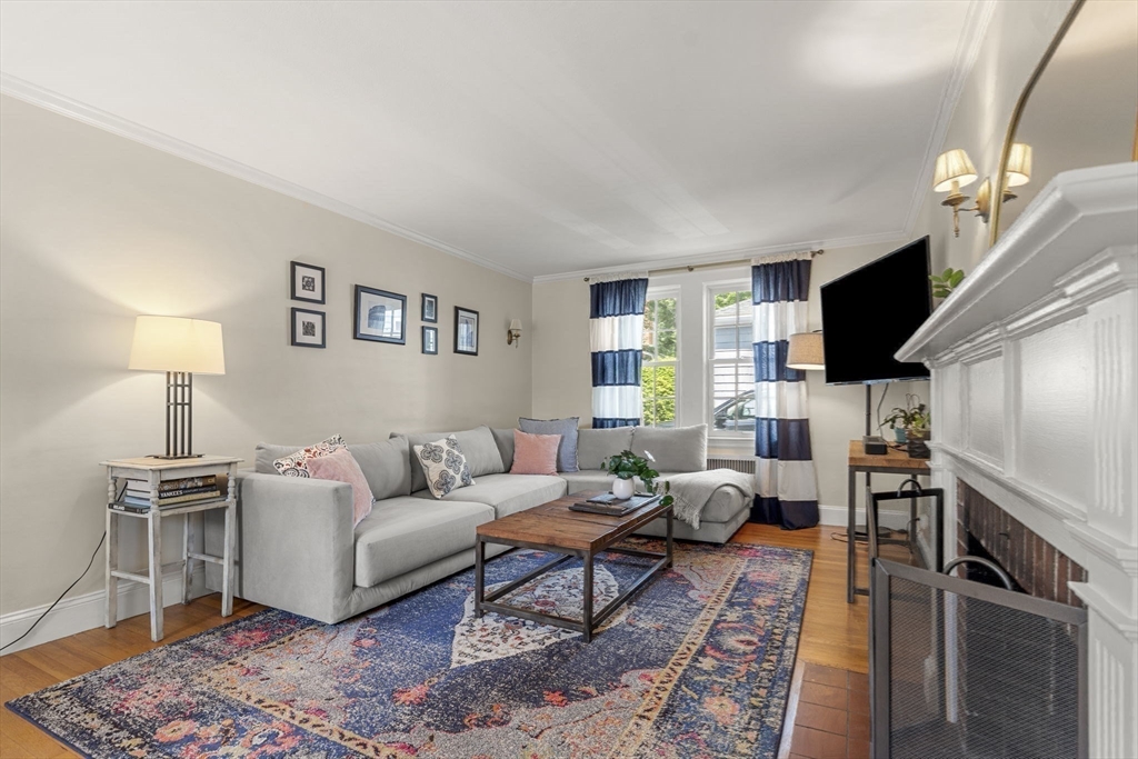 56 Allen Circle Milton, MA 02186 - Photo 16 of 34 a living room with furniture a flat screen tv and a lamp