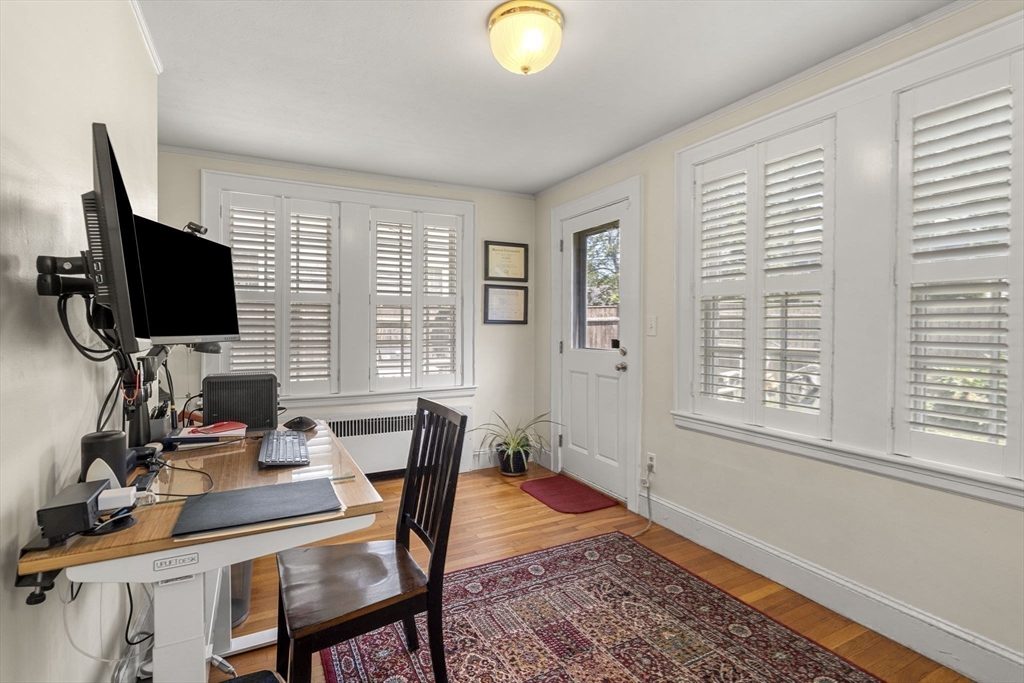 56 Allen Circle Milton, MA 02186 - Photo 18 of 34 a view of a workspace with furniture and a window