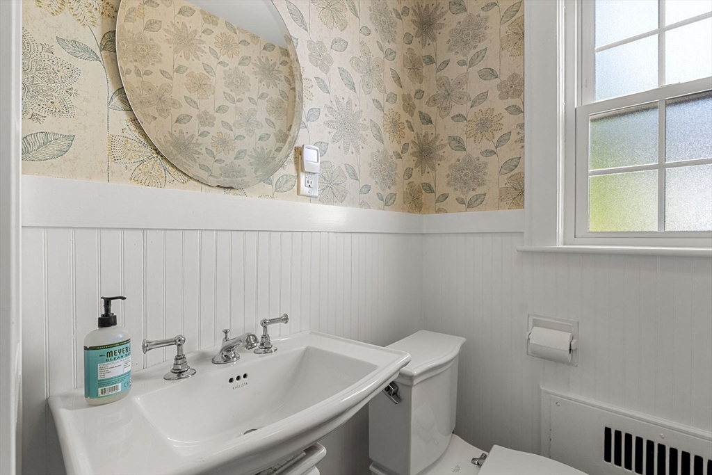 56 Allen Circle Milton, MA 02186 - Photo 19 of 34 a bathroom with a sink and a mirror