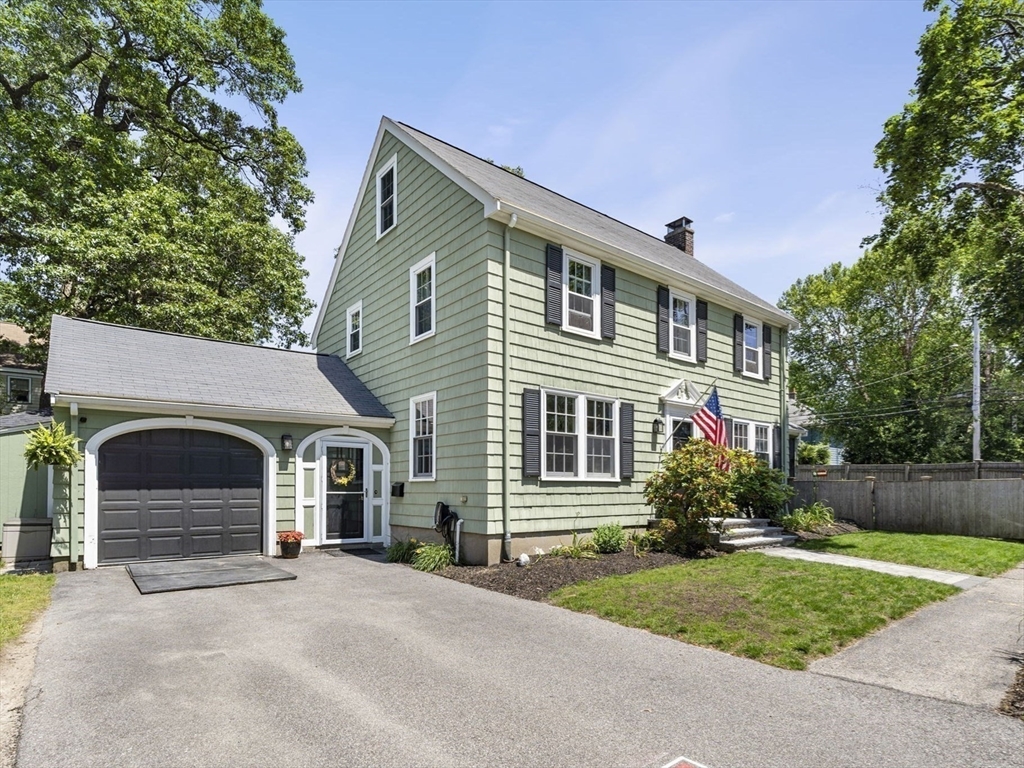 56 Allen Circle Milton, MA 02186 - Photo 2 of 34 a front view of a house with garden