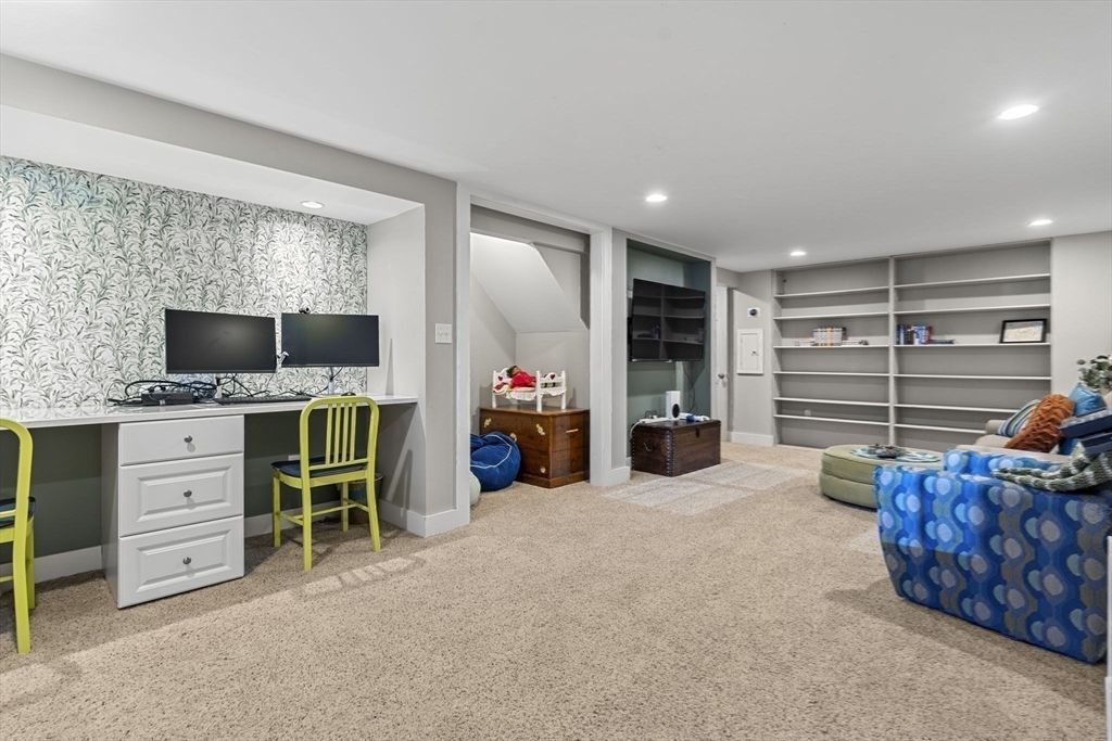 56 Allen Circle Milton, MA 02186 - Photo 26 of 34 a view of a livingroom with furniture and a flat screen tv
