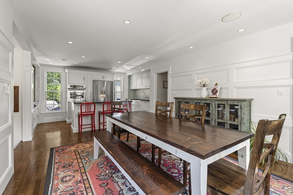 56 Allen Circle Milton, MA 02186 - Photo 4 of 34 a kitchen with stainless steel appliances granite countertop a stove and a dining table
