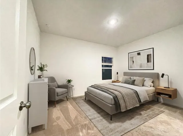 a bedroom with bed and window