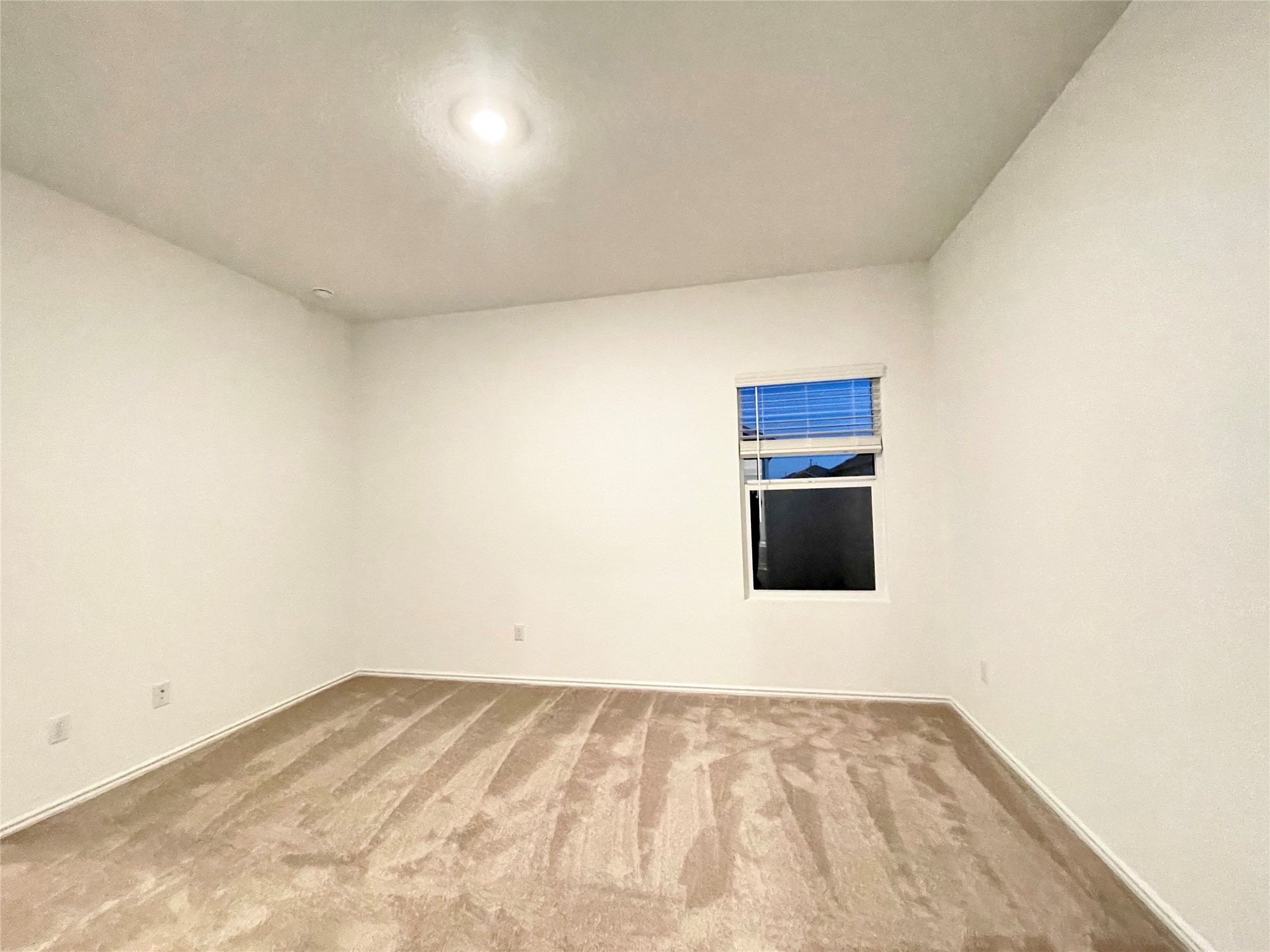 332 Amber Glen Maxwell, TX 78656 - Photo 13 of 24 a view of empty room with wooden floor and fan