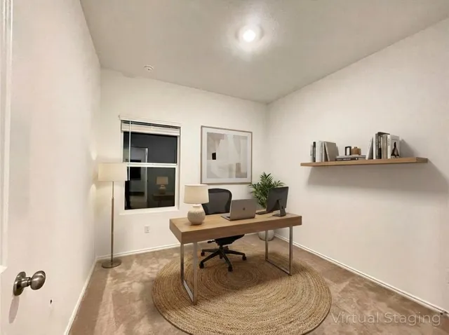 an empty room with a kitchen