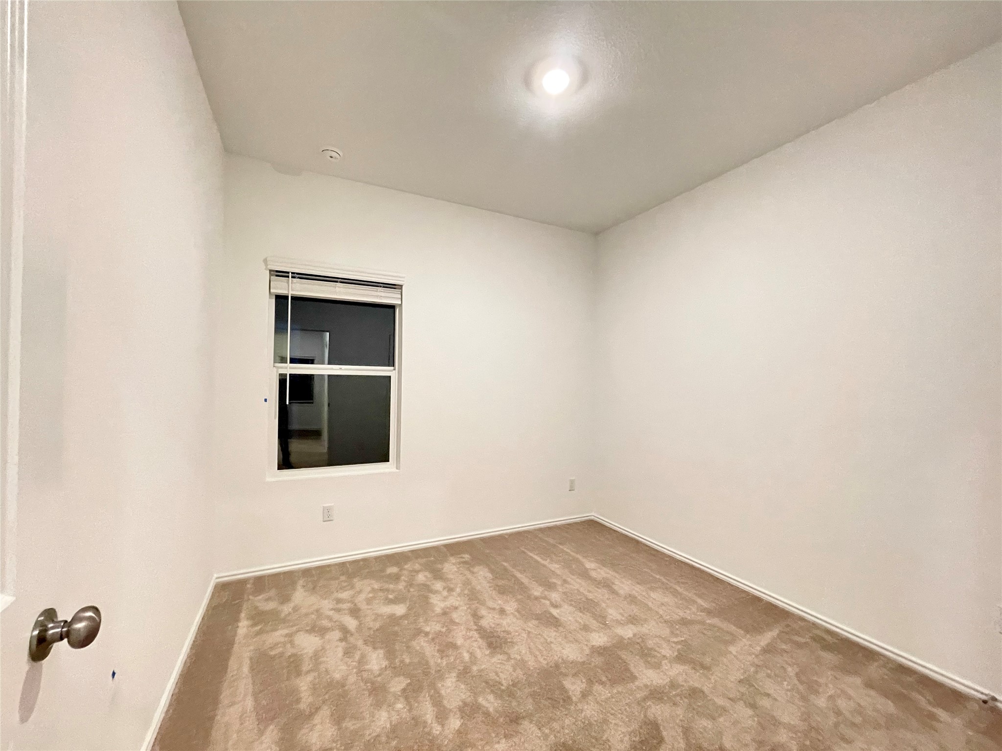 332 Amber Glen Maxwell, TX 78656 - Photo 17 of 24 an empty room with a kitchen