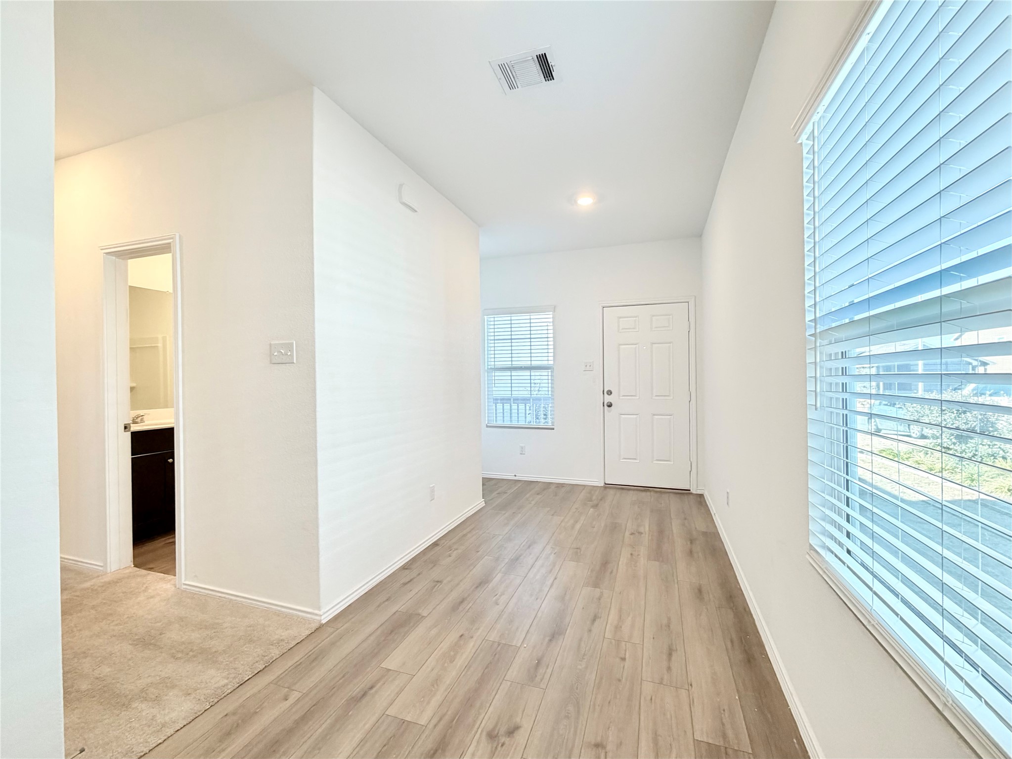 332 Amber Glen Maxwell, TX 78656 - Photo 3 of 24 wooden floor in an empty room with a window