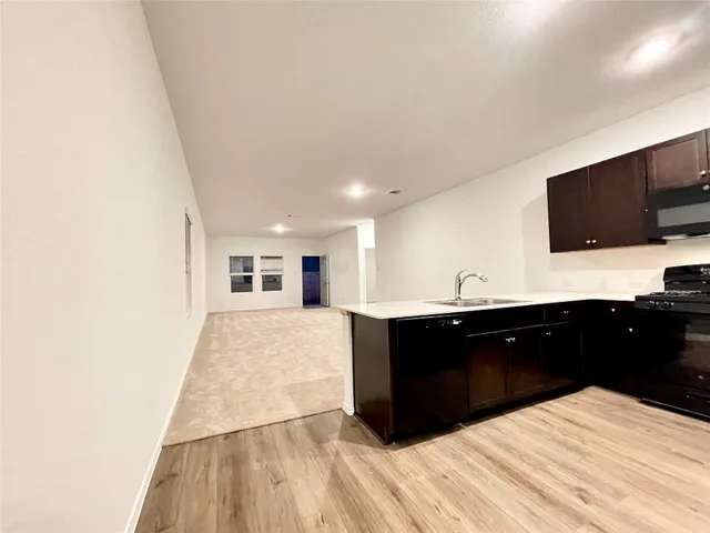 a spacious bathroom with a double vanity sink and a mirror